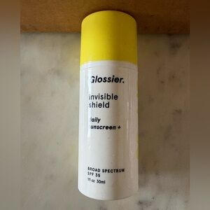 Glossier Invisible Shield SPF 35 Sunscreen - Yellow Cap, White Bottle